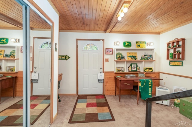 carpeted foyer entrance with wooden ceiling and ornamental molding