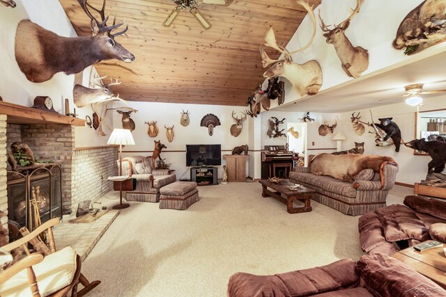 6610 E Arnold Lake Rd, Harrison, MI 48625 - carpeted living room featuring ceiling fan, wood ceiling, a fireplace, and high vaulted ceiling