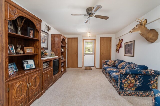 6610 E Arnold Lake Rd, Harrison, MI 48625 - living area with light colored carpet and a ceiling fan