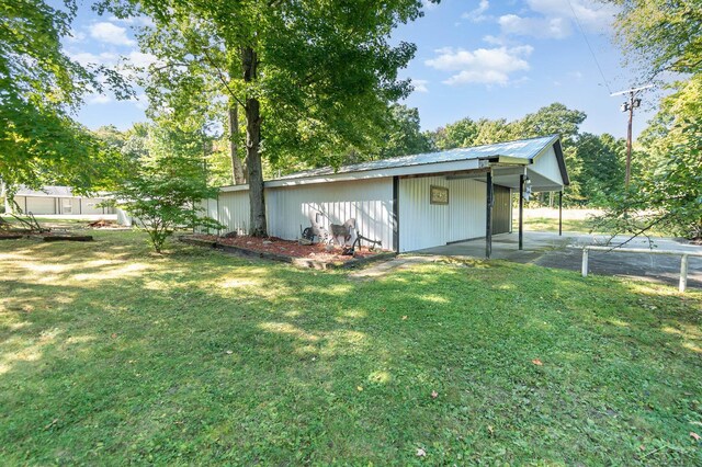 6610 E Arnold Lake Rd, Harrison, MI 48625 - view of outbuilding with a carport