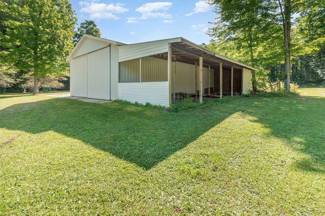 6610 E Arnold Lake Rd, Harrison, MI 48625 - view of pole building with a lawn
