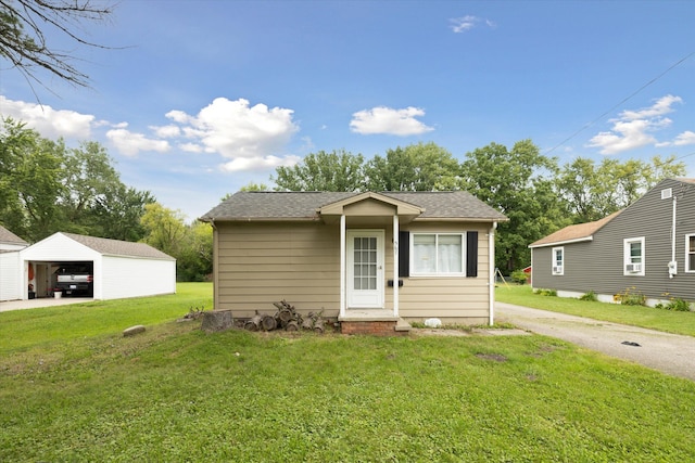 bungalow-style home with a front yard