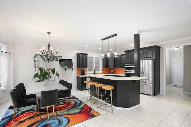 kitchen featuring backsplash, crown molding, a breakfast bar area, a kitchen island, and appliances with stainless steel finishes