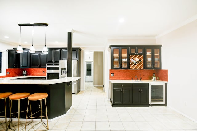 kitchen with tasteful backsplash, stainless steel appliances, crown molding, sink, and wine cooler