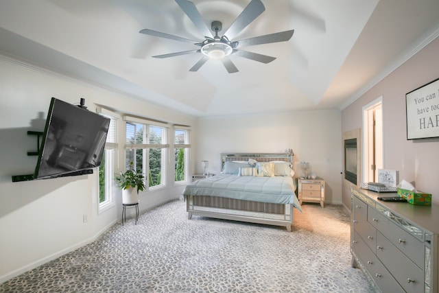 carpeted bedroom with ceiling fan and ornamental molding