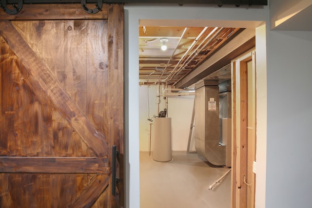 basement featuring gas water heater and heating unit