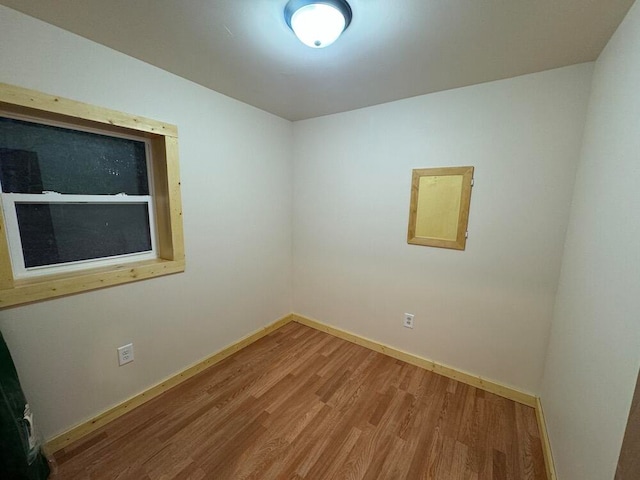 spare room with hardwood / wood-style floors