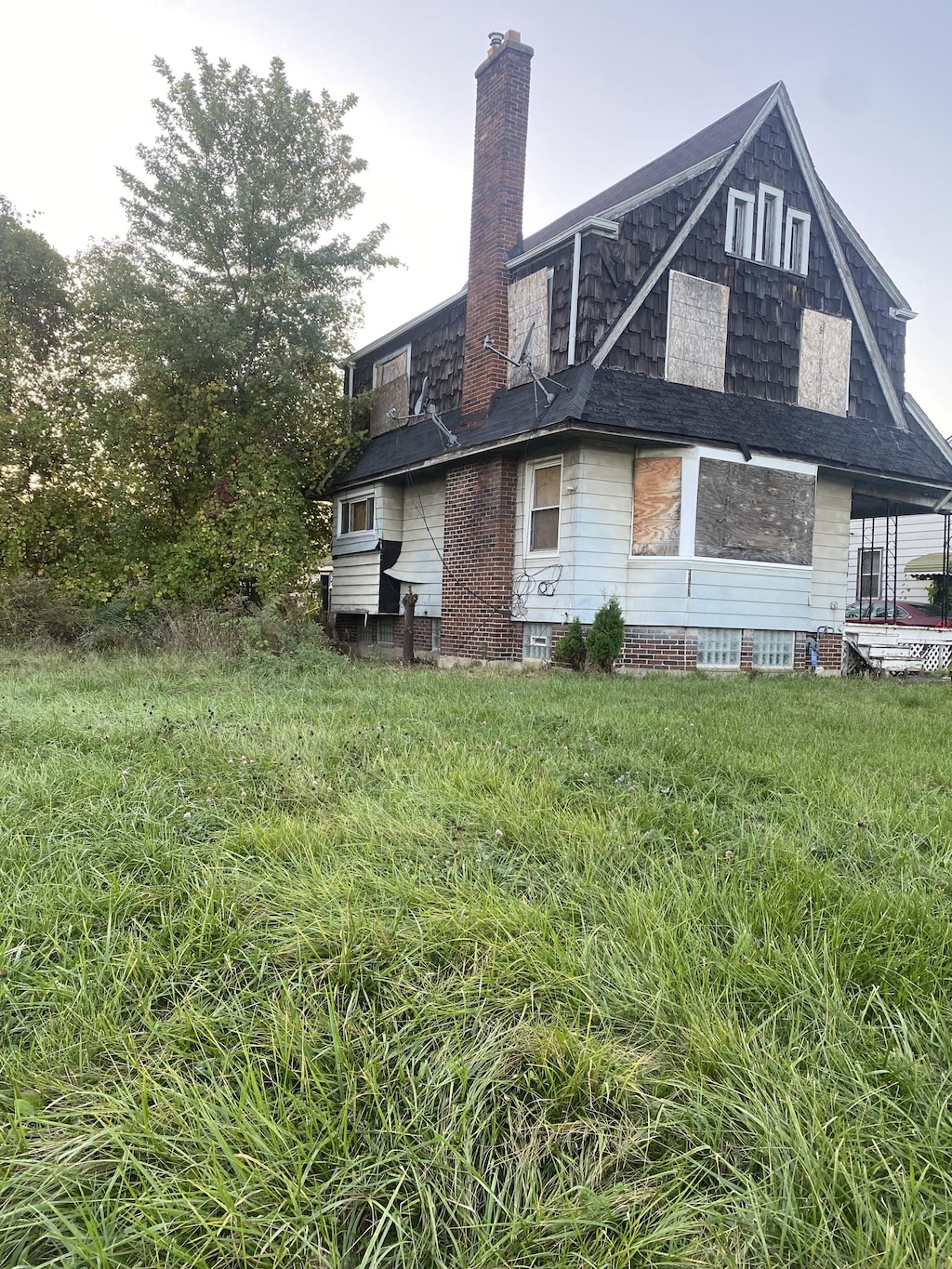 12835 Mark Twain St, Detroit, MI 48227 - back of house featuring a chimney