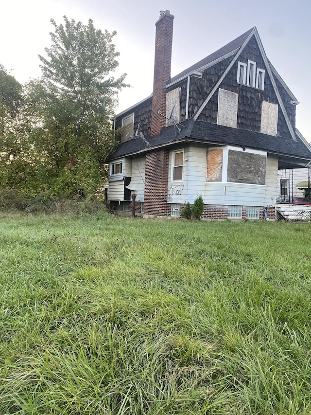 12835 Mark Twain St, Detroit, MI 48227 - back of house featuring a chimney