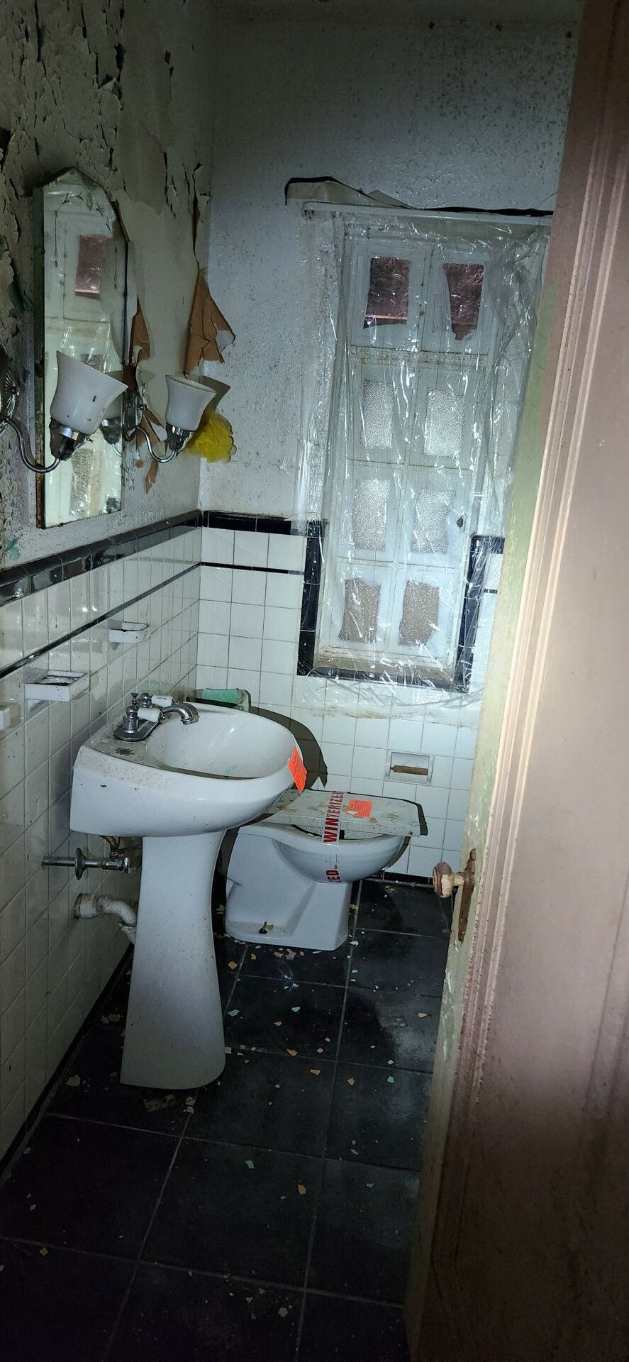 bathroom with tile patterned flooring and tile walls