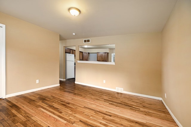 spare room featuring light hardwood / wood-style flooring