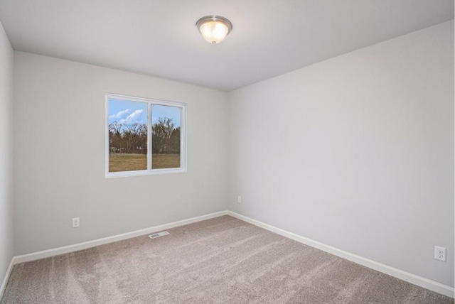 unfurnished room with carpet floors