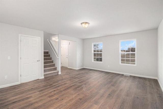 empty room with dark hardwood / wood-style floors