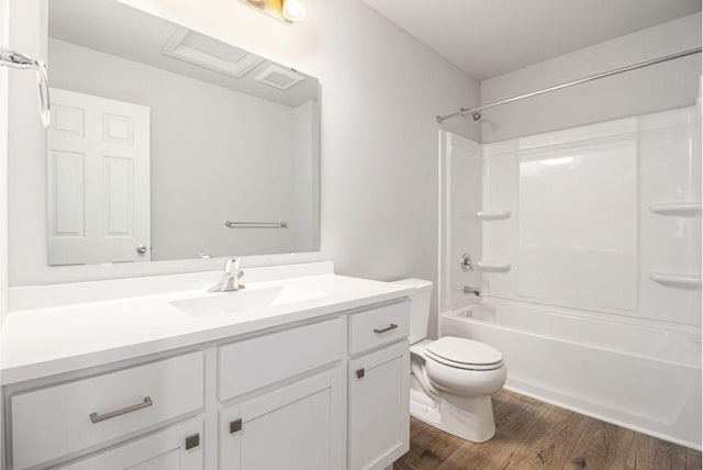 full bathroom with toilet, tub / shower combination, wood-type flooring, and vanity