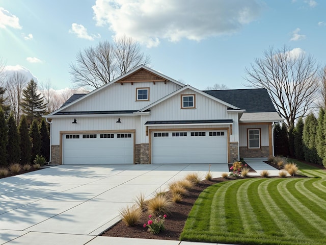 view of front of property with stone siding, driveway, and roof with shingles