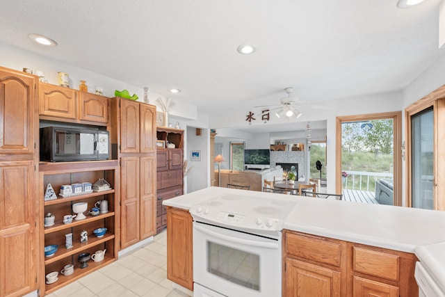 kitchen with open shelves, white electric range oven, black microwave, a ceiling fan, and a lit fireplace