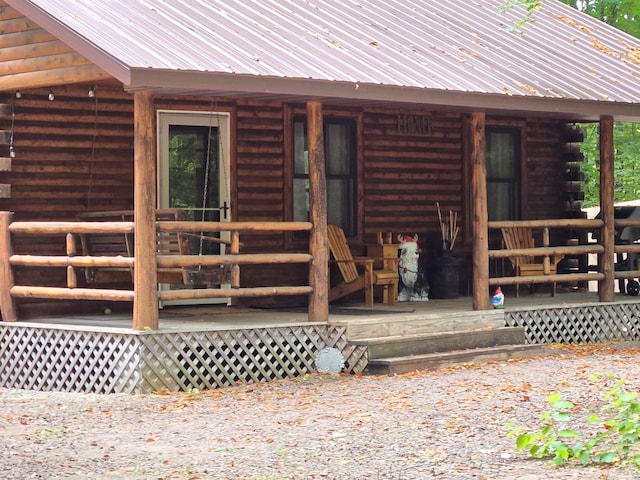 doorway to property with a porch