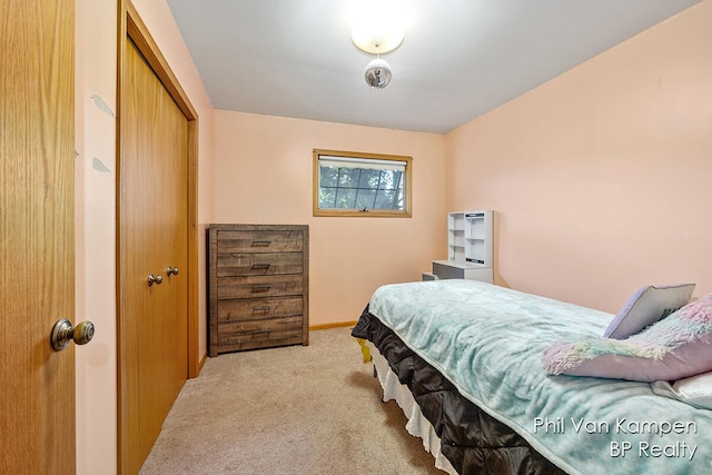 carpeted bedroom featuring a closet