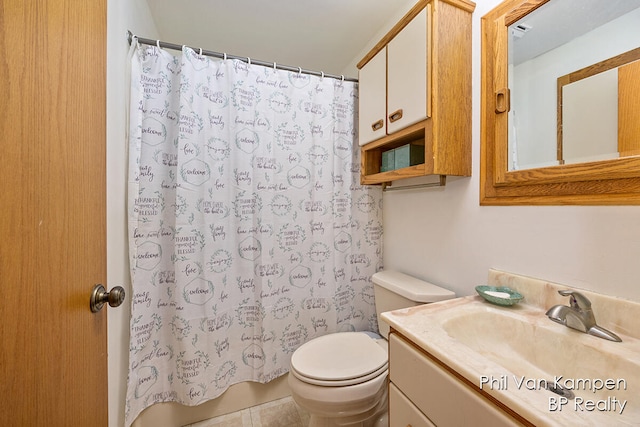 bathroom featuring tile patterned floors, a shower with curtain, vanity, and toilet