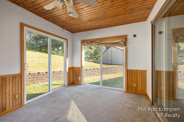 unfurnished sunroom featuring plenty of natural light and wood ceiling