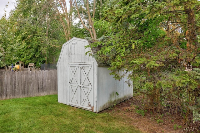 view of outdoor structure with a lawn