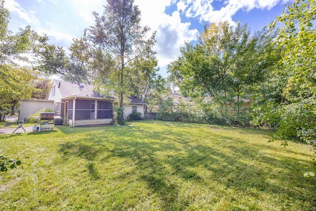 view of yard with a sunroom