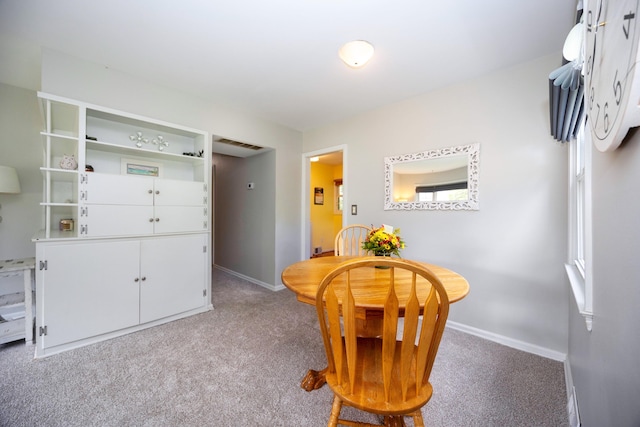 view of carpeted dining space