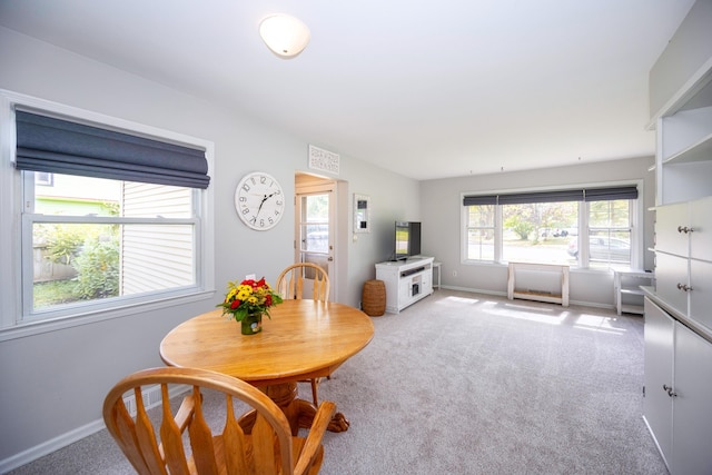 dining area featuring carpet flooring