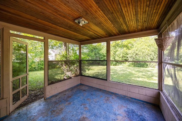 unfurnished sunroom with wooden ceiling