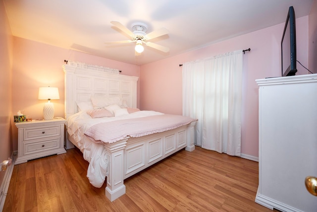 bedroom with ceiling fan and light hardwood / wood-style flooring