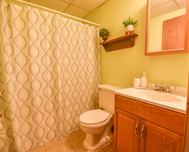 11768 Riker Rd, Litchfield, MI 49252 - bathroom featuring vanity, toilet, a drop ceiling, tile patterned flooring, and curtained shower