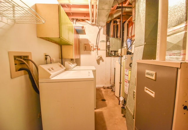 11768 Riker Rd, Litchfield, MI 49252 - washroom featuring washer and dryer, heating unit, and cabinet space