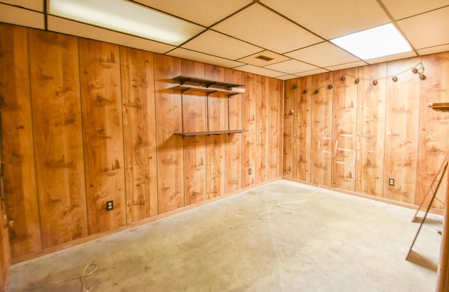 11768 Riker Rd, Litchfield, MI 49252 - basement with wooden walls and a drop ceiling