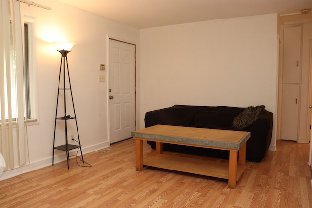 sitting room with hardwood / wood-style flooring