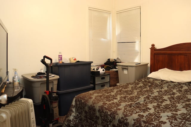 bedroom featuring radiator