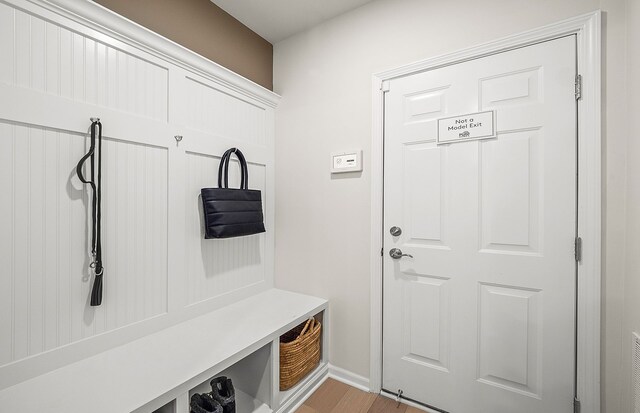 mudroom with light hardwood / wood-style floors