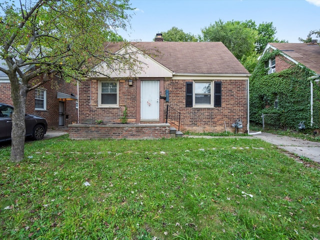 bungalow with a front lawn