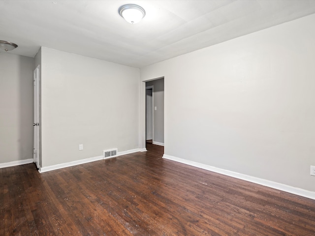 empty room featuring dark hardwood / wood-style floors