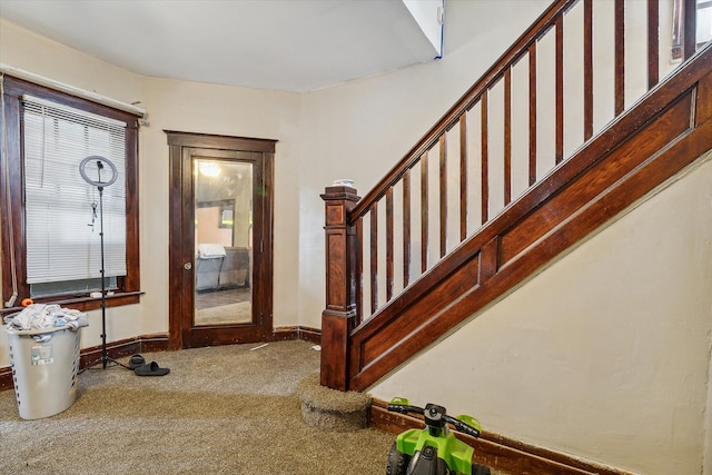 view of carpeted foyer