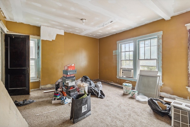 misc room with carpet flooring, cooling unit, and beamed ceiling