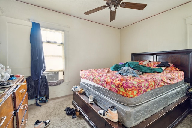 carpeted bedroom with ceiling fan and cooling unit