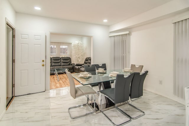 dining area with light wood-type flooring