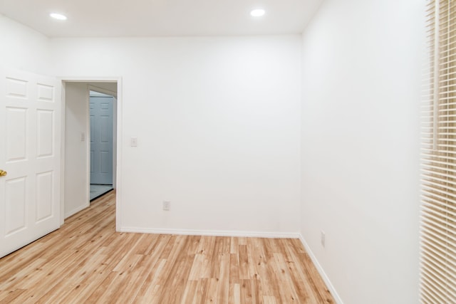 spare room with light hardwood / wood-style floors