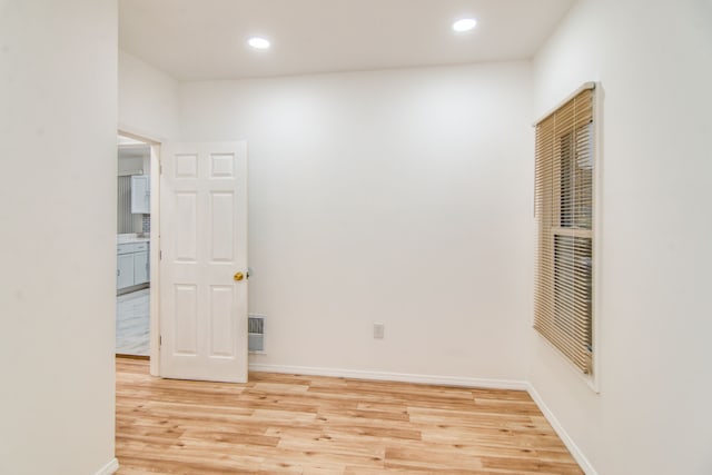 spare room featuring light hardwood / wood-style flooring