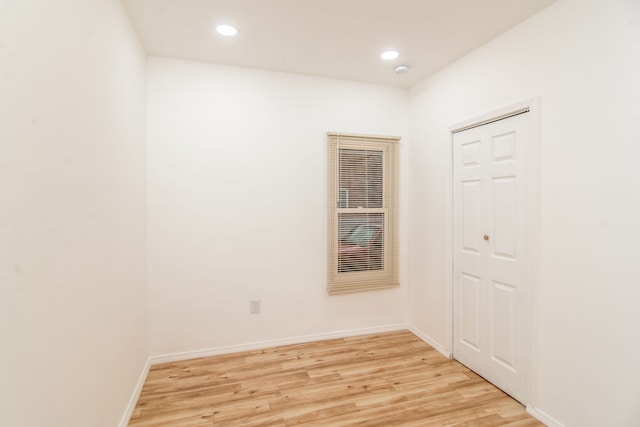 spare room with light wood-type flooring