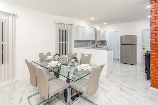 dining area featuring sink