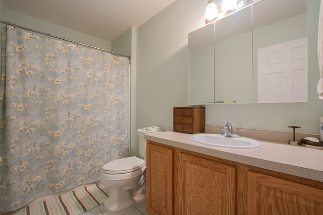 bathroom with tile patterned floors, vanity, and toilet