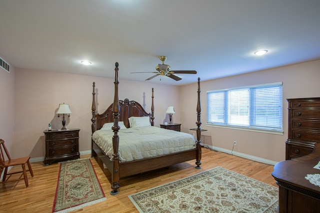 bedroom with light hardwood / wood-style floors and ceiling fan