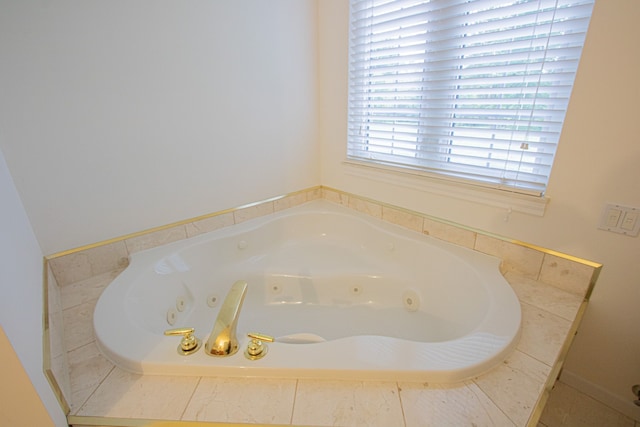 bathroom with tiled bath