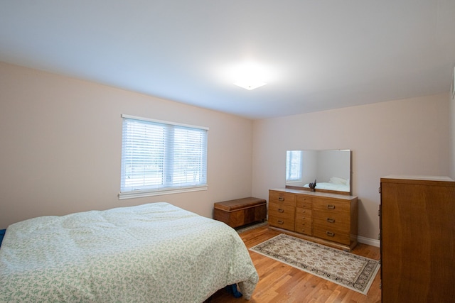 bedroom with light hardwood / wood-style floors